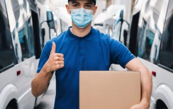 young-delivery-man-wearing-blue-polo-shirt-cap-medical-protective-mask-standing-with-cardboa